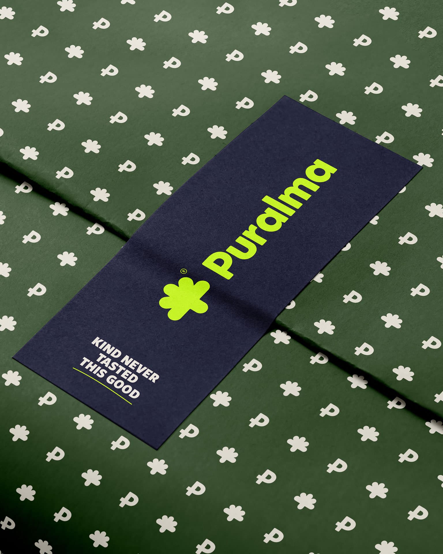 Puralma. Wrapping paper in the brand's flower and wordmark pattern.